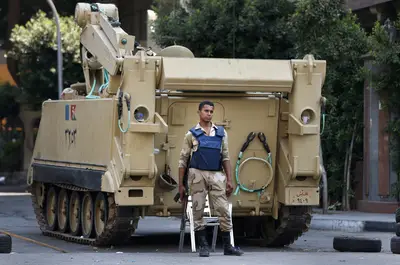 Egypt Continues State of Emergency - On Thursday, Egypt’s interim president, Adly Mansour, extended a nationwide state of emergency by two months, with the interim prime minister, Hazem el-Beblawi, citing “an increasingly tense situation.” Beblawi also told the local news on Wednesday that the nighttime curfew that has been in effect throughout most of the country might be eased ahead of schools and universities starting.(Photo: AP Photo/Lefteris Pitarakis)