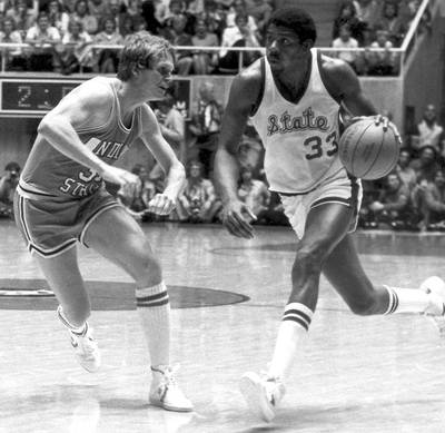 Earvin &quot;Magic&quot; Johnson - Playing for Michigan State, Magic Johnson bested the Bird-led Indiana State 75–64 for the NCAA title in 1979, a game that has been credited as the most watched in college basketball history. Johnson went on to enchant fans for 13 seasons in the NBA with the Los Angeles Lakers, and after announcing he had contracted HIV in 1991, he retired for good in 1996.&nbsp;(Photo: Michigan State/Collegiate Images/Getty Images)
