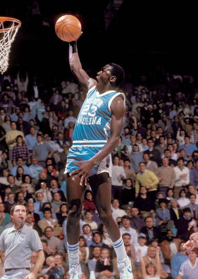 Michael Jordan - Before Michael Jordan ever splashed onto the NBA scene and subsequent international super-stardom, Dean Smith was molding his skills at the University of North Carolina&nbsp;from 1981-84. In fact, his game-winning shot in the 1982 NCAA championship game really put MJ on the basketball map. That shot would serve as the springboard for a Hall of Fame career, which included 14 All-Star selections, six NBA titles to go with six Finals MVPs, and five league MVPs with the Chicago Bulls,&nbsp;as arguably the greatest player ever. Through the years, MJ would not only credit Smith as a great basketball mentor, but he would refer to the coaching legend as his &quot;second father.&quot;&nbsp;&nbsp;(Photo: Jerry Wachter/Sports Imagery/Landov)