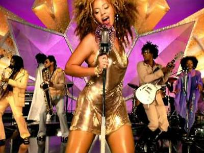 &quot;Work It Out&quot; - The funky tune was the lead single in Austin Powers in Goldmember, in which&nbsp;Beyoncé plays Foxxy Cleopatra. Fittingly, the colorful music video featured the singer shaking it in a gold dress and a full head of bouncy curls.  (Photo: Sony Music)