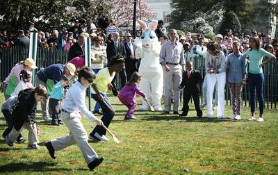 Well Done! - The Obama family cheers a group of kids competing to roll their egg to the finish line first.(Photo: Alex Wong/Getty Images)