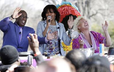Love in Her Heart - During a cooking demonstration with the Today show's Al Roker and chef Annie Burrell, the first lady, who &quot;loves a little love&quot; in her food, broke into song, and urged the audience to join her in &quot;Put a Little Love in Your Heart.&quot;(Photo: REUTERS/Jonathan Ernst)