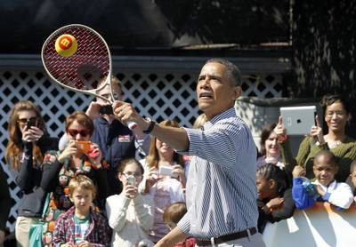 Big Serve - Obama shows off his tennis skills for a group of admiring observers. (Photo: REUTERS/Jason Reed)