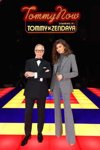 Runway Slay - After her iconic Tommy X Zendaya runway show during Paris Fashion Week, Zendaya posed with Tommy Hilfiger with one of the custom pieces from their 70s inspired collection!&nbsp;(Photo: Tim P. Whitby/WireImage)&nbsp;