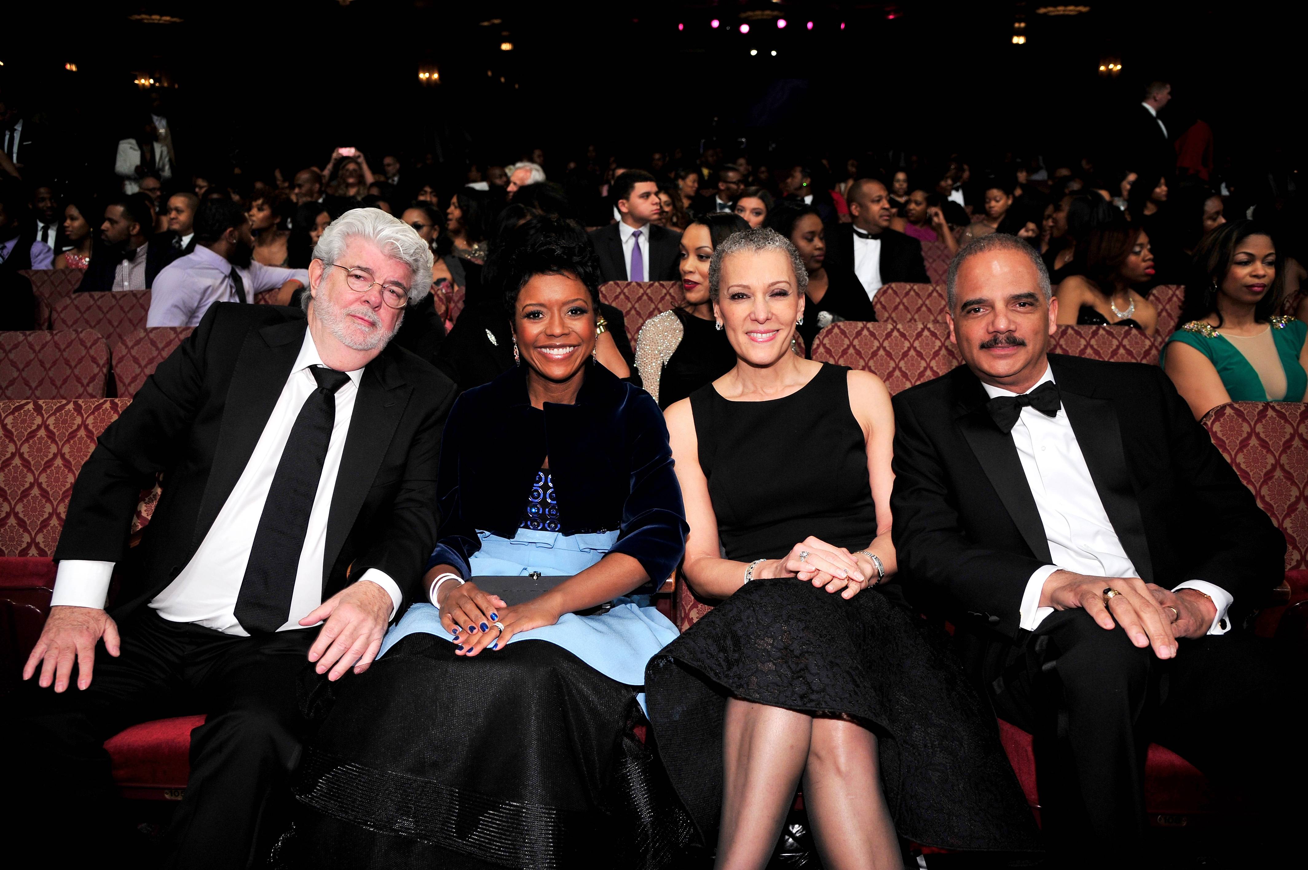 Front Row&nbsp; - Filmmaker George Lucas and his wife and&nbsp;Corporate Citizen honoree Mellody Hobson sit alongside Sharon Malone and husband and Public Service honoree Eric Holder during the pre-show.(Photo: Kris Connor/BET/Getty Images for BET)