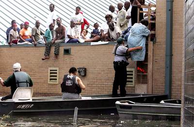 Worst Nightmare - A woman is rescued from a school rooftop after being trapped with dozens of others in high water in Orleans parish. Katrina made landfall as a Category 4 storm with sustained winds in excess of 135 mph. The school, Dr. Martin Luther King Jr. Charter School for Science and Technology, in the Lower 9th Ward, had closed after Katrina left it under 14 feet of water. The school re-opened in August 2007.&nbsp;(Photo: Mario Tama/Getty Images)