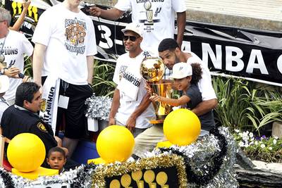 Spurs Celebrate NBA Title With Parade - Work hard, play hard. After defeating LeBron James and the Miami Heat in five games during the NBA Finals, the Spurs celebrated their fifth league title with a fan-filled championship parade down the River Walk in San Antonio. &quot;It is soaking in, but I'm still going to live it up for about the whole summer,&quot; NBA Finals MVP Kawhi Leonard told the Associated Press. &quot;(I haven't slept) very much. I've been trying to live the moment. It's been hard to sleep still. Thought I would get some sleep after we won the Finals, but I'm still celebrating. Go Spurs Go! San Antonio!&quot;&nbsp;(Photo: Michael Thomas/AP Photo)