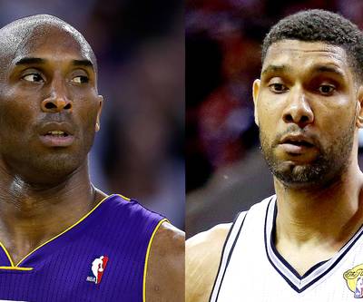 Kobe Bryant Doesn't Want to See Tim Duncan Win Sixth Title - Don’t think the ultra-competitive Kobe Bryant isn’t aware that Tim Duncan has five NBA championship rings just like he does. Speaking to ESPN while on vacation at the 2014 FIFA World Cup in Brazil on Wednesday, Bryant just doesn’t want to see the San Antonio Spurs big man win a sixth title before he does. “If you ask me if I’m OK with Tim [winning his sixth championship], I’m not,” Bryant said. “I’m not OK with that.”&nbsp;(Photos from left: Ezra Shaw/Getty Images, Andy Lyons/Getty Images)