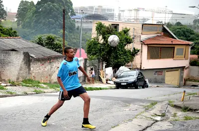 Overcoming Humble Beginnings in Sao Paulo - Before we can even begin to discuss Pelé's greatness on and off the soccer field, we have to point out that the man overcame all odds growing up in poverty — stricken Bauru, Sao Paulo. There, he was taught soccer by his father, although they were so poor that they couldn't even afford a proper ball. Instead, Pelé honed his skills dribbling and kicking around a grapefruit and even a sock stuffed with a newspaper and tied to a string. Where there's a will, there's a way. Ask Pelé.(Photo: Friedemann Vogel/Getty Images)
