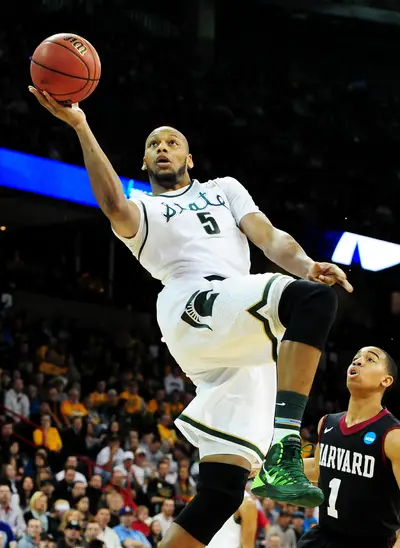 14. Phoenix Suns—Adreian Payne (Michigan State) - A 6-10, 245-pound power forward who shot a sizzling 42% from three-point range, Adreian Payne fits right into the Phoenix Suns' run-and-gun style. He showed he can also bring the Payne, averaging seven boards per game. An all-around, picture-perfect selection for Phoenix.&nbsp;(Photo: Steve Dykes/Getty Images)