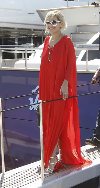 Yacht Life - Rita Ora&nbsp;smiles in her bright red caftan as she leaves Cavalli's boat during the 67th Cannes Film Festival.&nbsp;(Photo:&nbsp;KCS Presse / Splash News)