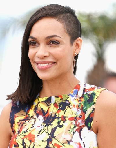 Rosario Dawson  - Rosario brings her signature edge to Cannes with a shaved ?do, paired with minimal makeup and a million dollar smile.   (Photo: Andreas Rentz/Getty Images)