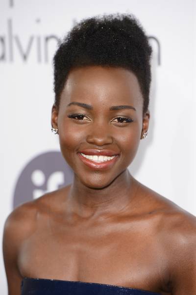 Lupita Nyong'o  - If you?re a blessed soul who has flawless skin like Lupita?s, a rich gloss and full brows are more than enough to enhance your natural beauty. P.S. love the hair!   (Photo: Ian Gavan/Getty Images)