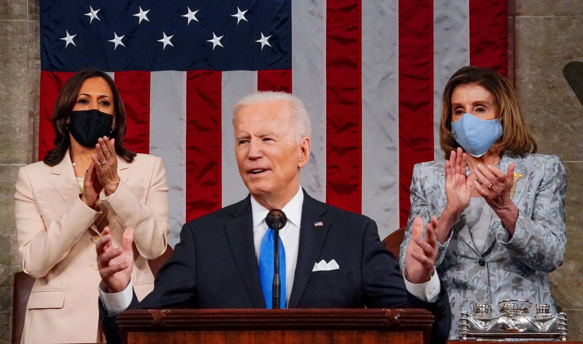 WASHINGTON, DC - APRIL 28: President Joe Biden addresses a joint session of Congress, with Vice President Kamala Harris and House Speaker Nancy Pelosi (D-Calif.) on the dais behind him, on Wednesday, April 28, 2021. Biden spoke to a nation seeking to emerge from twin crises of pandemic and economic slide in his first speech to a joint session of Congress. (Melina Mara/The Washington Post)