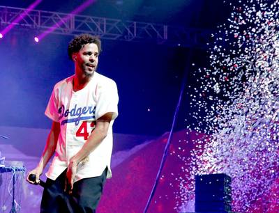 J. Cole Went Platinum - Who the hell is buying these J. Cole albums? That's the question many industry insiders were asking when the Roc Nation talent sold 361,120 copies of his third release, 2014&nbsp;Forest Hill Drive, in its first week back in December. The No. 1 project even beat boy band heavyweights One Direction's Spotify record of 11.5 million streams (young Jermaine boasted 15.7 million). Yes, everyone seemed to be shocked that the understated, no frills emcee was able to knock even Taylor Swift from the top spot. Everyone except Cole, whose connection to his intensely loyal fanbase is quite remarkable.Could you imagine Beyonc? inviting her rabid BeyHive followers to her childhood home through social media to personally listen to tracks from her new album? Or Kanye charging fans a ridiculously low $1 for a series of secret shows? J. Cole has done both, carving out a repu...