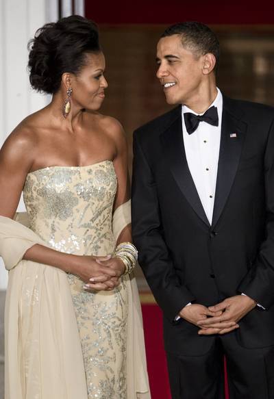 It's Really All About the Dress, Right? - First Lady Michelle Obama and President Obama hosted their very first state dinner on Nov. 24, 2009, for India's Prime Minister Manmohan Singh and his wife Gursharan Kaur. Few people likely remember the meal, but they'll never forget how beautifully the first lady shined in this gown by designer Naeem Khan.  (Photo: Brendan Smialowski/Getty Images)