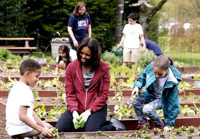 From Garden to State Dinner Table - On April 15, the first lady and a group of school children from around the nation planted five different vegetables in the White House kitchen garden. Their crop included bok choy, which will be featured in the consommé. Farms from around the nation also provided vegetables on the menu.  (Photo: Gary Cameron/Landov)