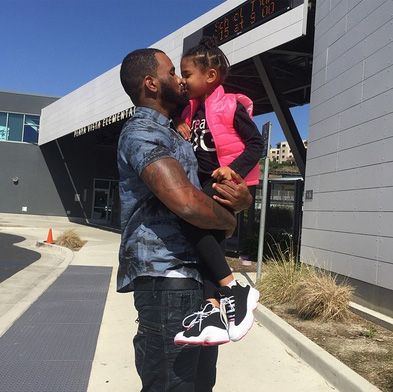 Game and California Dream Taylor - Planting a loving smooch on daughter Cali, the rapper captions this pic on IG, 