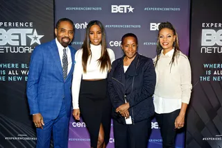 At the Center of It All - BET's President of Media Sales Louis Carr poses with Kelly Rowland and MC Lyte at this year's upfront presentation.   (Photo: Timothy Hiatt/BET Networks)