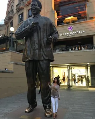 Rocsi Diaz - The TV personality looks itty-bitty next to a famed statue of South African icon Nelson Mandela in Johannesburg.(Photo: Rocsi Diaz via Instagram)