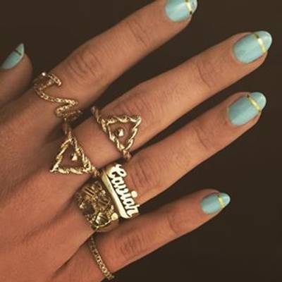 Melody Ehsani - The fashion designer's gold game is strong. Peep the metallic stripe over her seafoam green base. (Photo: Melody Ehsani via Instagram)