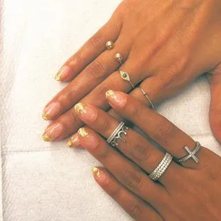 Nazanin Mandi - The model/actress rocks the most delicate gold leaf foil across the tips of her nails. Basically, our new favorite twist on the classic French manicure.(Photo: Nazanin Mandi via Instagram)