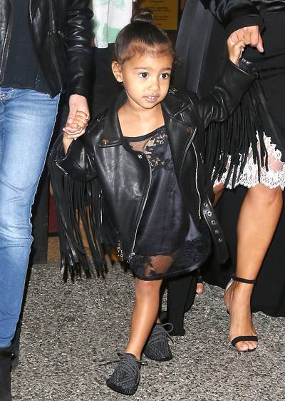 Fabulous in Fringe - For an NYC outing to see The Lion King on Broadway, North wore a fringe-tastic leather jacket and Yeezys, of course.(Photo: Splash News)
