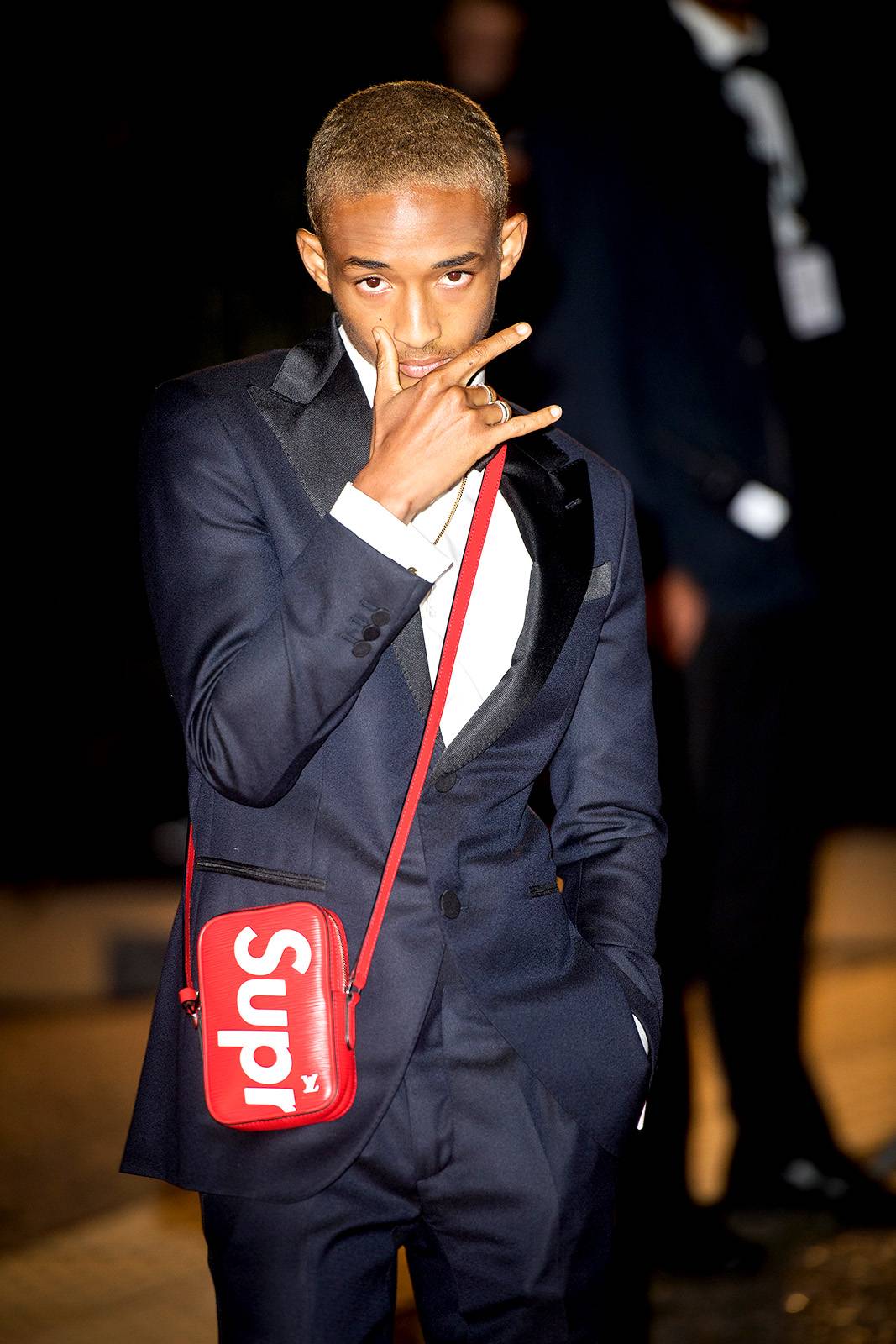 Jaden Smith in suit and street brand supreme (crossbody bag