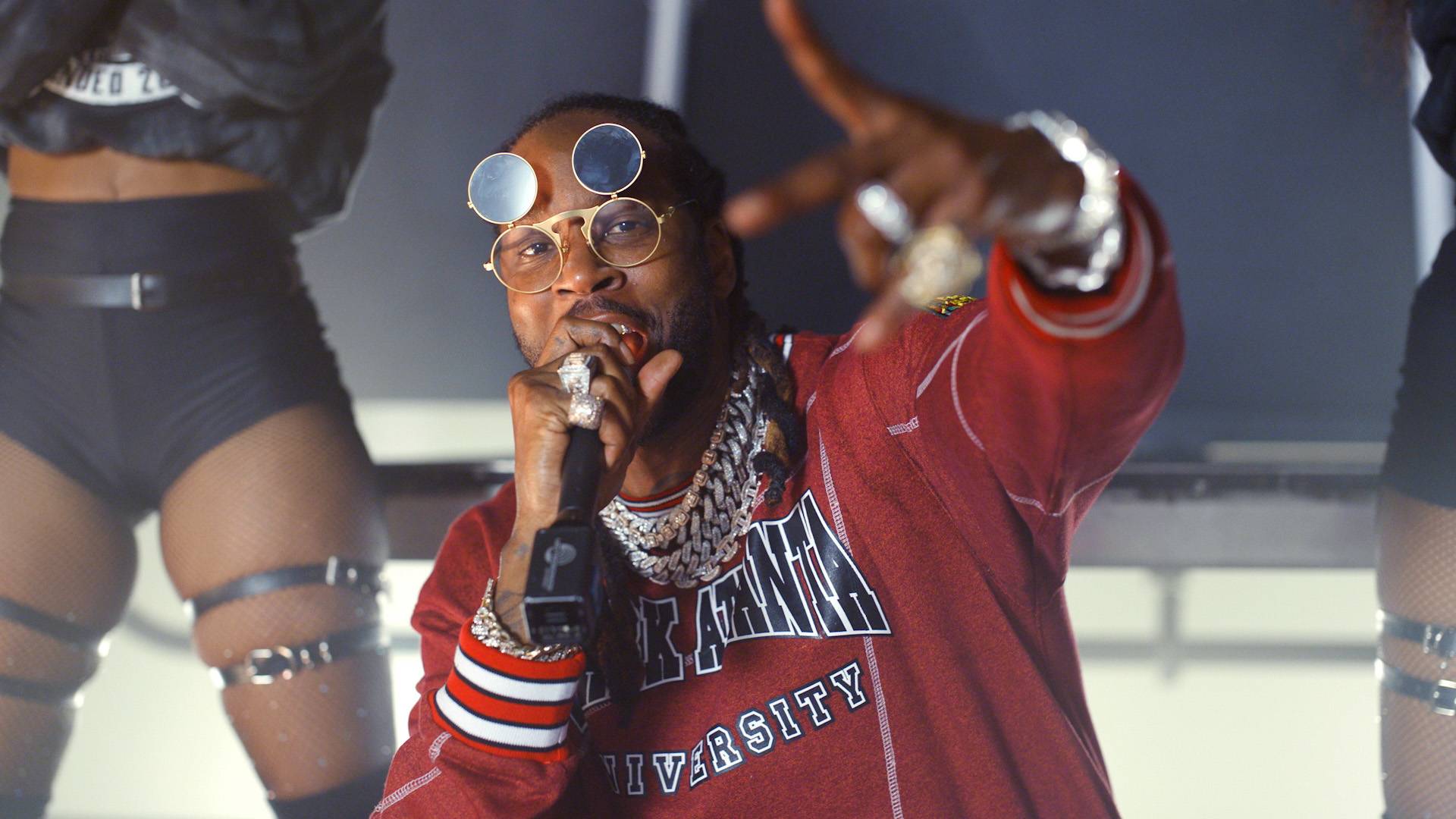 2 Chainz performing in a red shirt at the BET Hip Hop Awards 2020.