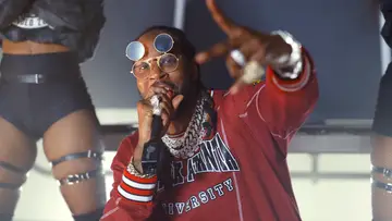 2 Chainz performing in a red shirt at the BET Hip Hop Awards 2020.