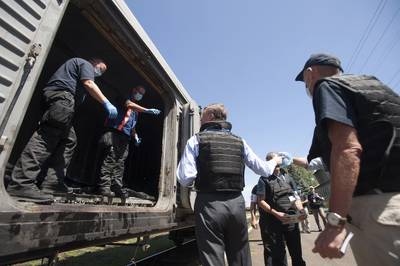 A Step Forward - After initially refusing access to the crash site, Kremlin-backed separatists on July 21 allowed the 282 bodies of the crash victims to be recovered and transported away on a refrigerated train. They also agreed to turn over the airplane's two black boxes to Malaysian investigators.(Photo: AP Photo/Evgeniy Maloletka)