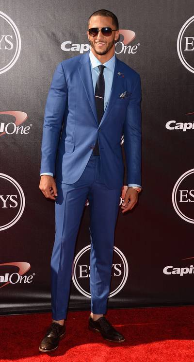 Colin Kaepernick - Just call him Mr. Touchdown! The San Francisco 49ers QB certainly stands out in his cobalt blue Isaia suit and vintage Louis Vuitton shades.  (Photo: Jason Merritt/Getty Images)