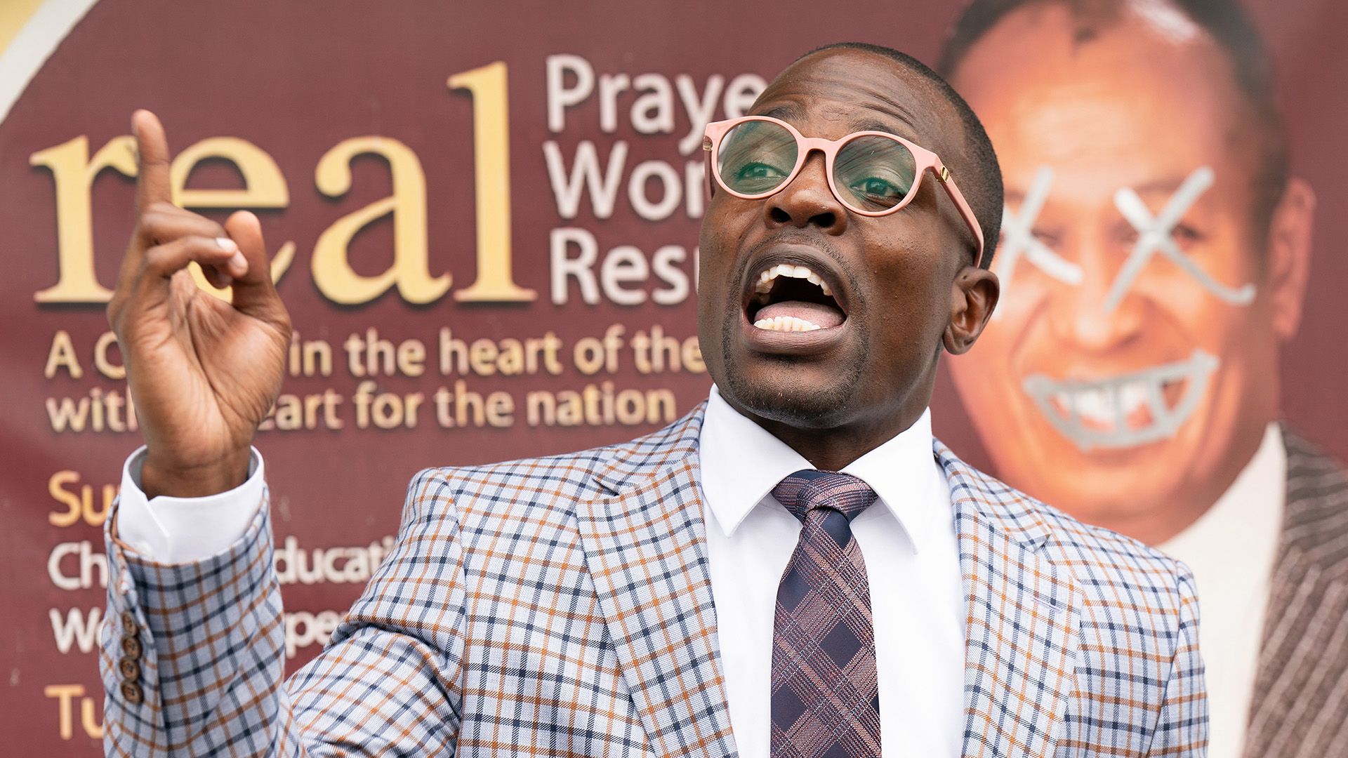 A photo of a pastor being confronted by his congregation