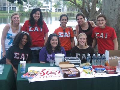 Community Service - The ladies of Allison's sorority sell candy by the lake.