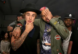 Bros 4 Life - Justin Bieber and Chris Brown had their own BFF moment making funny faces at the NYLON party.  (Photo: Chelsea Lauren/Getty Images for NYLON)