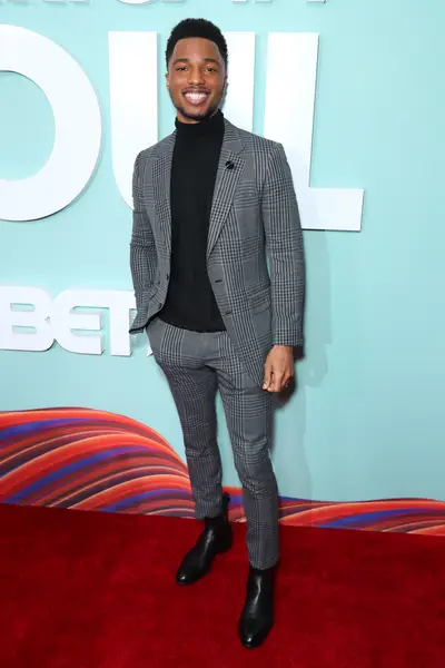 Christopher Jefferson poses on the red carpet. - (Photo by Leon Bennett/Getty Images for BET)
