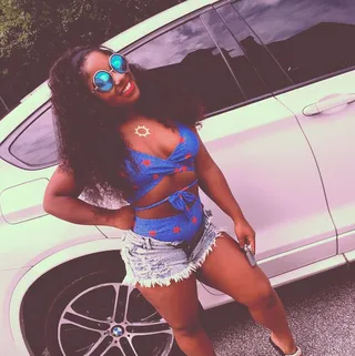 Reginae Carter - For a recent pool day, Lil Wayne’s baby girl looks adorbs in a star-spangled one-piece with ab cutouts, teamed with oval mirrored shades. (Photo: Reginae Carter via Instagram)