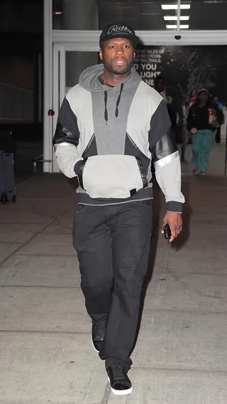 Power Suit - 50 Cent doesn't have to compromise comfort for style in his geometric hoodie as he catches a flight out of JFK Airport in New York City.  (Photo: RGK, PacificCoastNews)