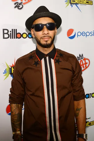 Dapper Dan - Swizz Beatz attends the Pepsi/Billboard Summer Beats concert wearing a cool straw fedora and a star embroidered button-down.  (Photo: Larry Busacca/Getty Images for PEPSI)