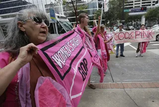 Women's Rights - Karen Boyer of grass-roots group Code Pink stands up for women's rights. (Photo: AP Photo/Dave Martin)&nbsp;