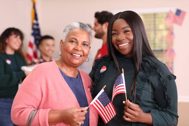 two women holding American Flag