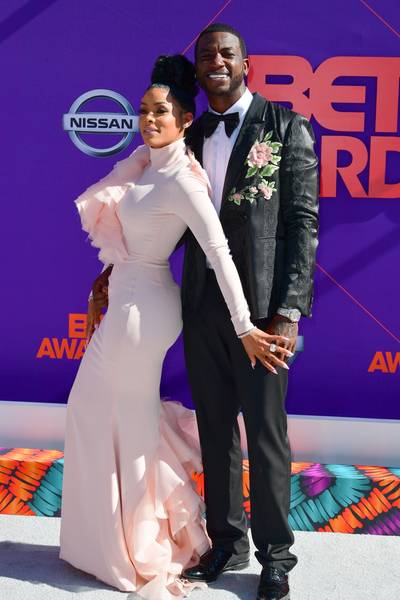 2018: Gucci Mane and Keyshia Ka’oir&nbsp;&nbsp; - Is it just us, or does pink really complement Keyshia Ka’oir’s skin? The business mogul’s floor-length dress, featuring ruffle detailing, paired perfectly with her husband’s tailored suit with exquisite floral embroidery. And take a look at that bling! It’s no surprise that Gucci Mane and wifey are iced out to the max—they don’t call him the Ice Man for no reason.&nbsp; (Photo by Prince Williams/Getty Images)