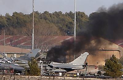 Jet Crash Kills 10, Injures 21 - A Greek fighter jet crashed at a military base in Spain on Monday, killing at least 10 Greek and French military workers, BBC reports. According to Spain's defense ministry, the F-16 jet &quot;lost power&quot; and crashed at Los Llanos air base in Albacete. At least 21 were reported injured.(Photo: AP Photo/Josema Moreno)