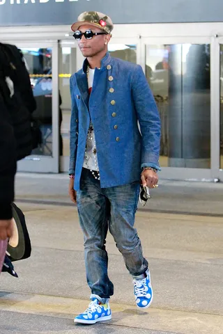 Busy P - Pharrell Williams arrives at the LAX airport in Los Angeles wearing varying shades of blue just after announcing the 2015 Live Earth Concert at Davos with former Vice President Al Gore.(Photo: Pedro Andrade / Bruja, &nbsp;PacificCoastNews)