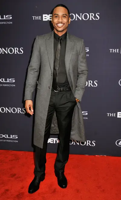 Trigga GQ  - R&amp;B crooner Trey Songz serves up a very smooth business look for the carpet. The gray overcoat makes the outfit really come alive! (Photo: Kris Connor/BET/Getty Images for BET)