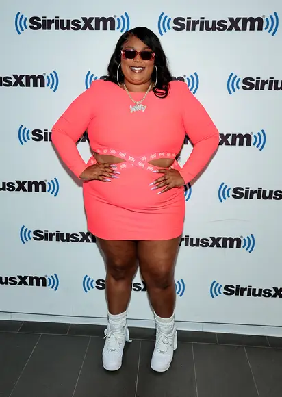 Stunning In Blue Sequins  - Image 36 from Barbiecore!: Lizzo Perfectly  Coordinates Her Bright Pink Hair With A Pink Leopard Print Ensemble