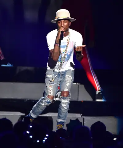 Passion for Phashion - The always stylish&nbsp;Pharrell Williams performs onstage during the iHeartRadio Jingle Ball 2014, hosted by Z100 New York and presented by Goldfish Puffs, at Madison Square Garden in New York City.(Photo: Mike Coppola/Getty Images for iHeartMedia)