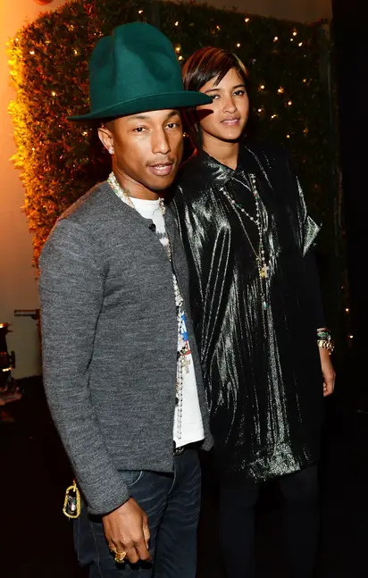 Model Helen Lasichanh and recording artist Pharrell Williams attend