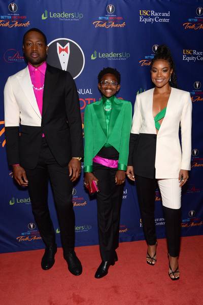 Zaya's First Red Carpet Appearance - Zaya Wade made her red-carpet debut over the weekend, accompanying her parents, Gab Union and Dwyane Wade to the annual Truth awards honoring trailblazers in the LGBTQ+ community.The entire family was dressed to impress in coordinating tuxedos. Gab and D-Wade wore black and white tuxedos accented in hot pink and green, while Zaya wore a green blouse and tuxedo jacket with black pants accented in hot pink. All of their looks were designed by Richfresh, and Zaya’s look was pulled together with black Jimmy Choo booties and a pink, satin clutch. Her rings were designed by celebrity favorite Lorraine Schwartz.&nbsp;(Photo: Andrew Toth/Getty Images)&nbsp;