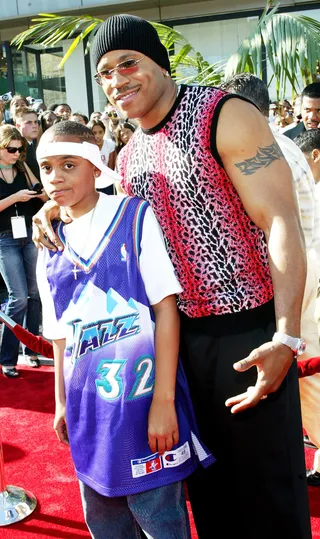 LL Cool J - The rapper and actor smiles at the cameras with his son in tow. &nbsp;(Photo: Frederick M. Brown/Getty Images)